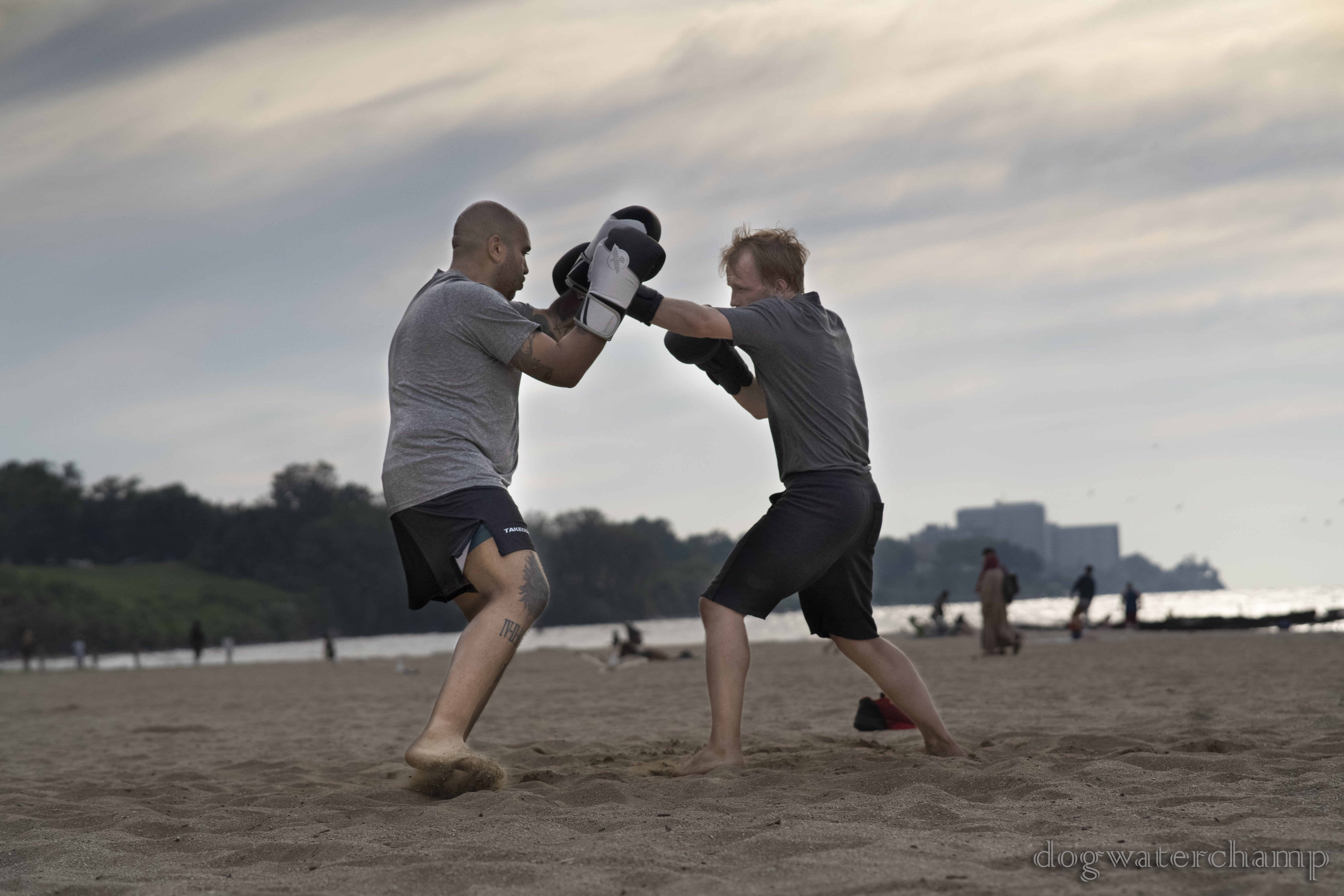 Boxers sparring in the sand at Edgewater Beach